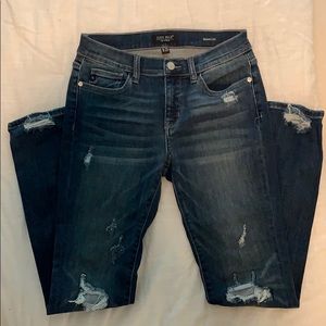 High-waisted, dark wash, jeans.